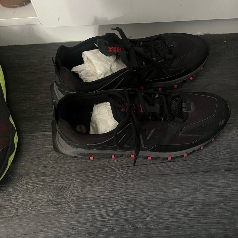 Black on Black men’s New Balance sneakers worn once